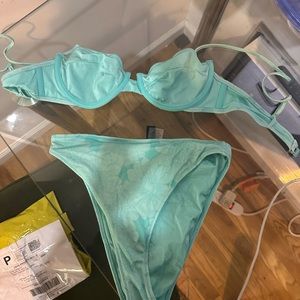 Triangl swimsuit, turquoise blue with flowers.